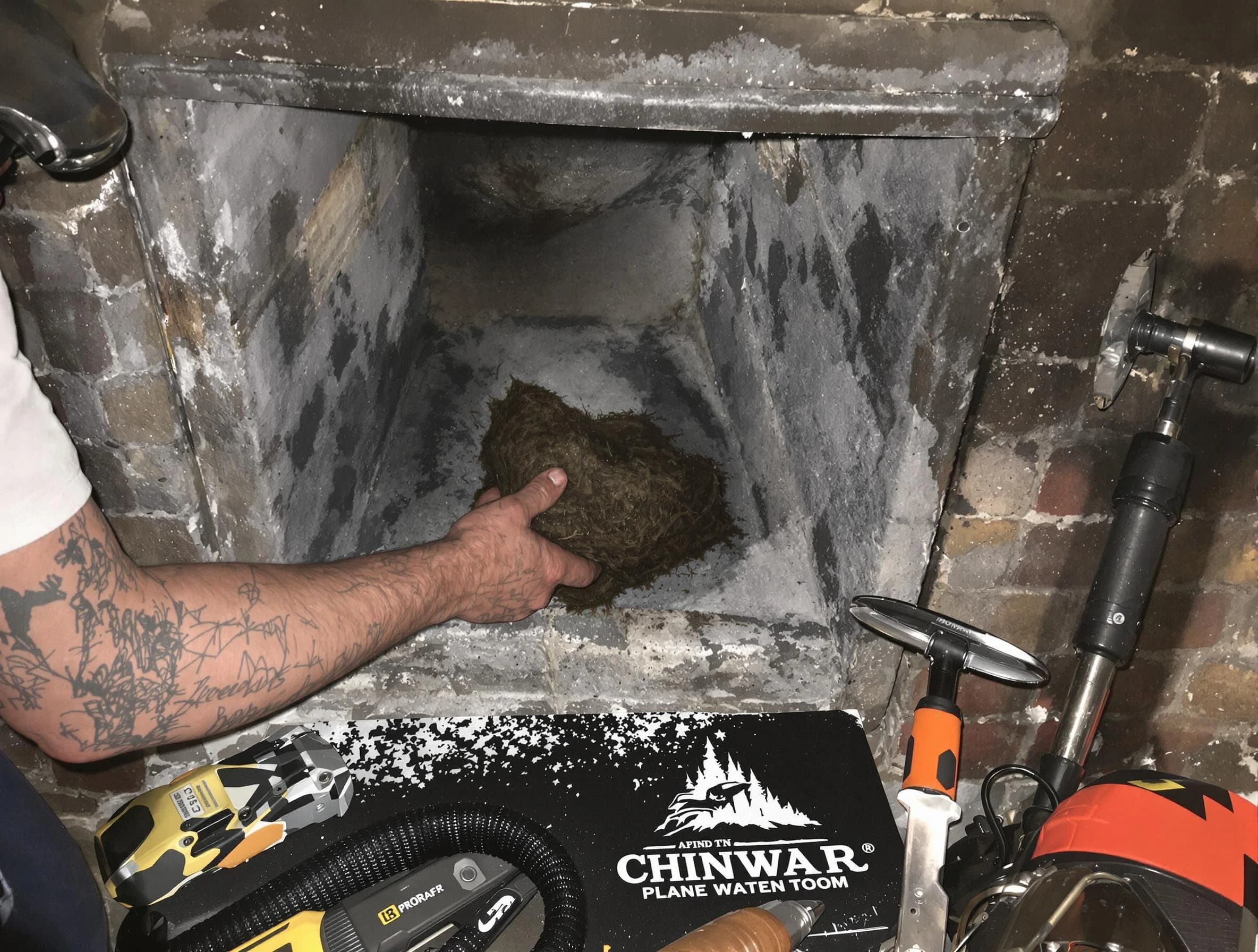 West Mifflin Chimney Sweep safely removing debris and screening chimney in West Mifflin, PA